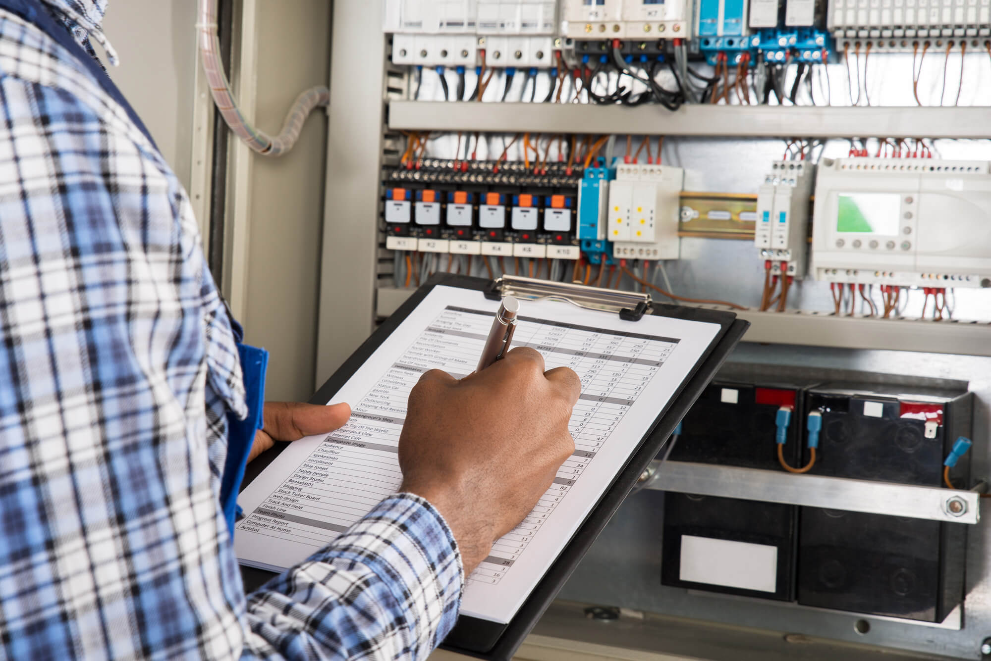 Inspector examining electrics