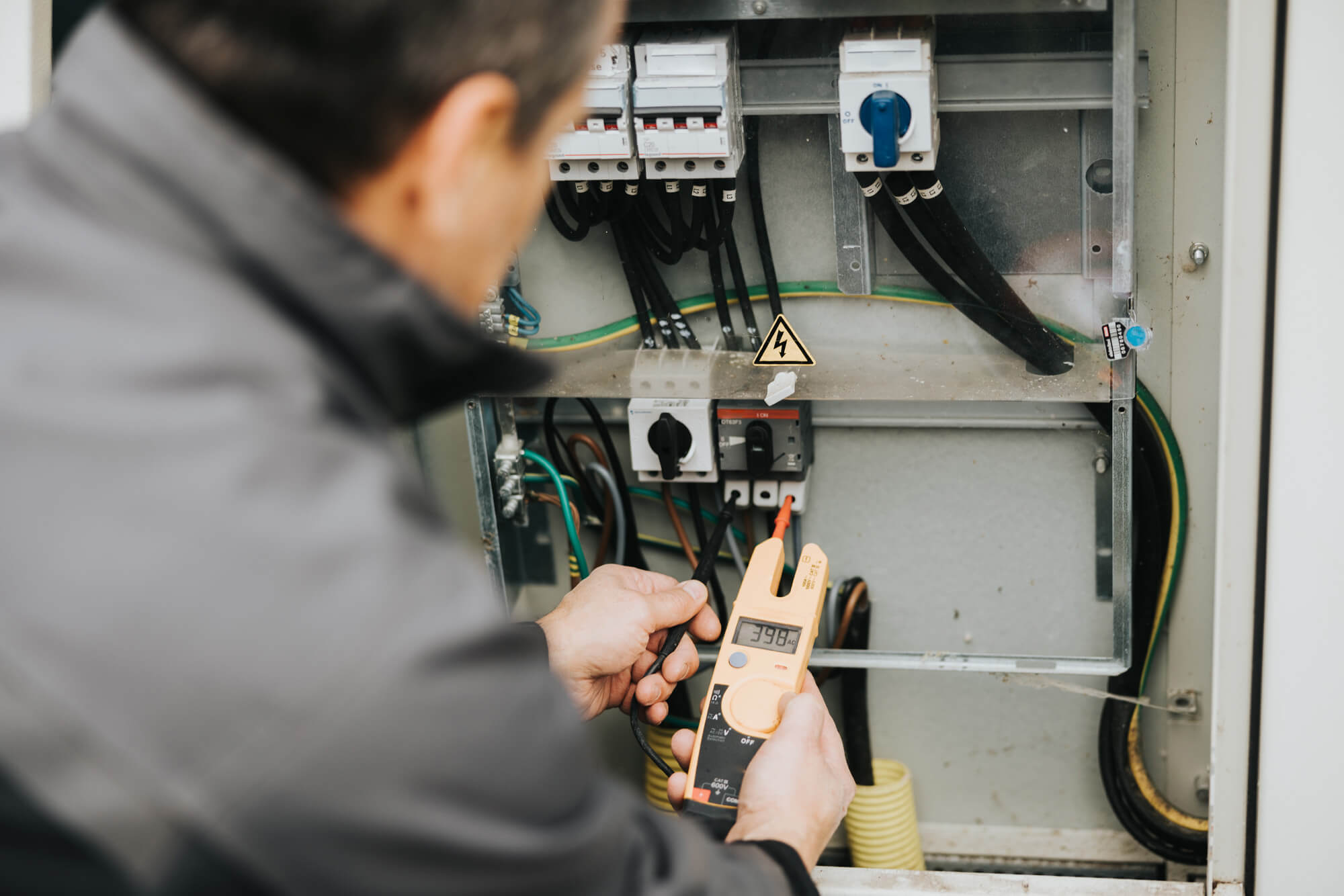Man performing electrical maintenance